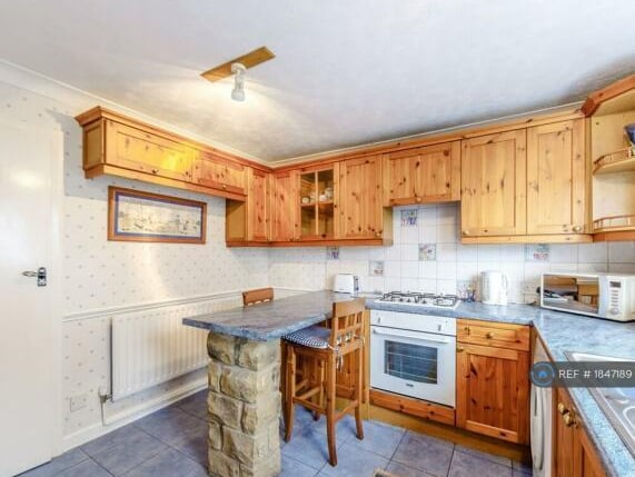 The house has a lovely breakfast kitchen with fully-fitted units.