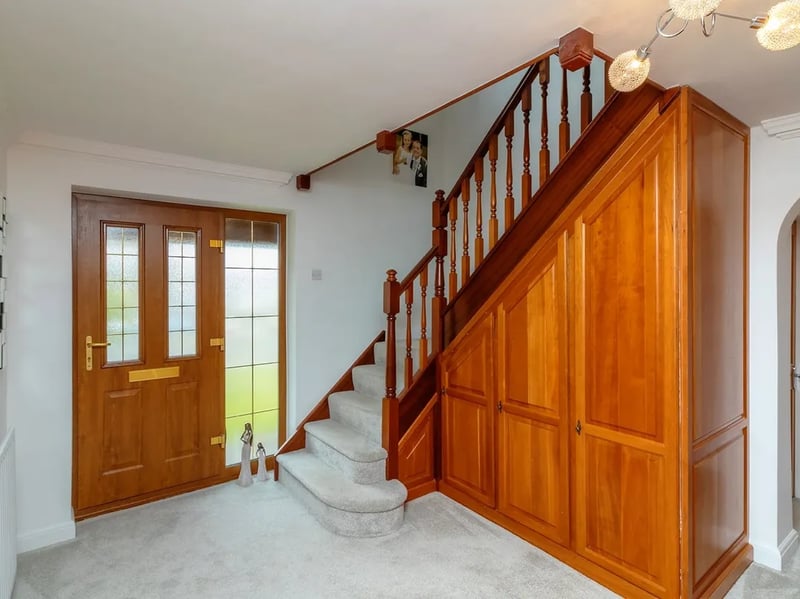 The entrance hall has a "feature open staircase" taking you up to the first floor.
