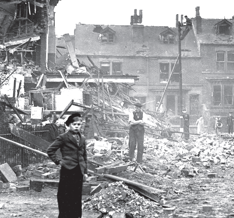 A boy stands amid the devastation of the Sheffield Blitz