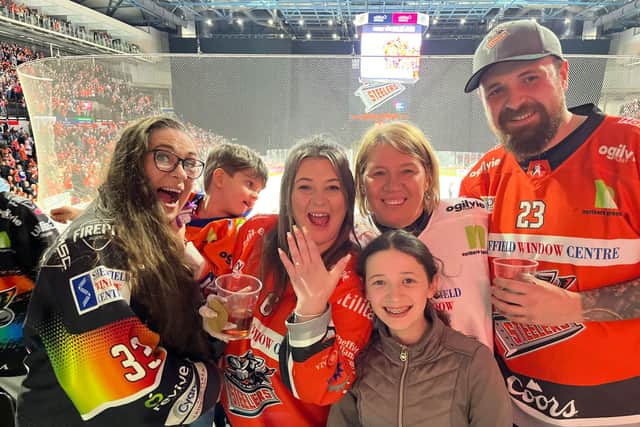 Jess, Callum and family after the plan was complete. Callum worked with the Steelers' staff and both their families to make the moment come together.