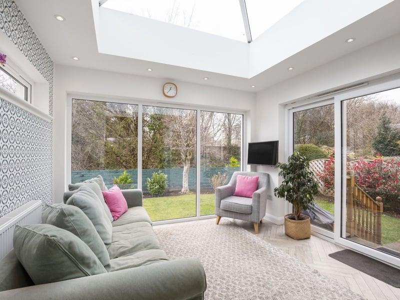 The fabulous light filled garden room with patio doors leading to the rear garden.