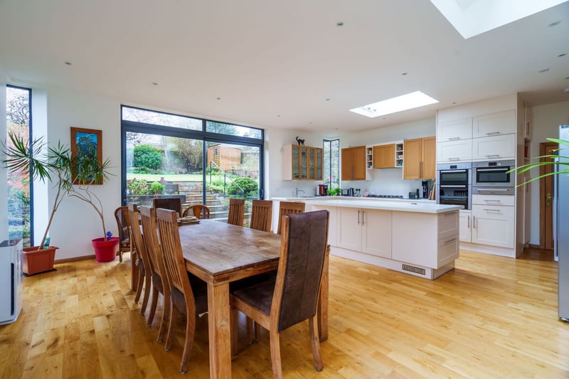 The heart of the home is the superb open plan kitchen diner and family room. With floor to ceiling windows, sliding doors and skylights, the space is flooded with natural light.