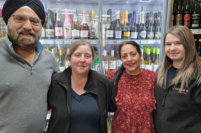 Chadha and Harbir with staff members, Kerry Holmes, left, and Amy Rudge.