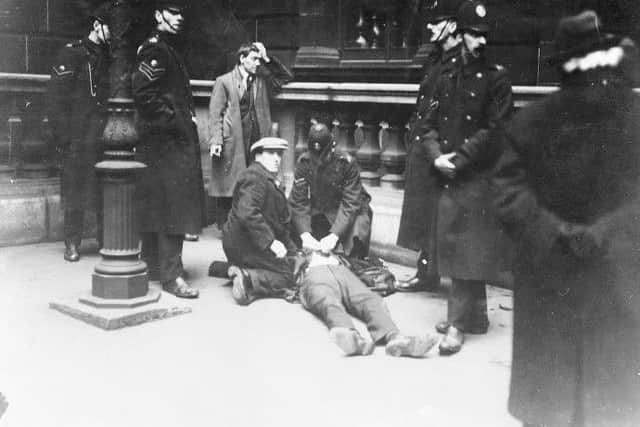 David Kirkwood on the ground after being struck by police batons during the Battle of George Square.