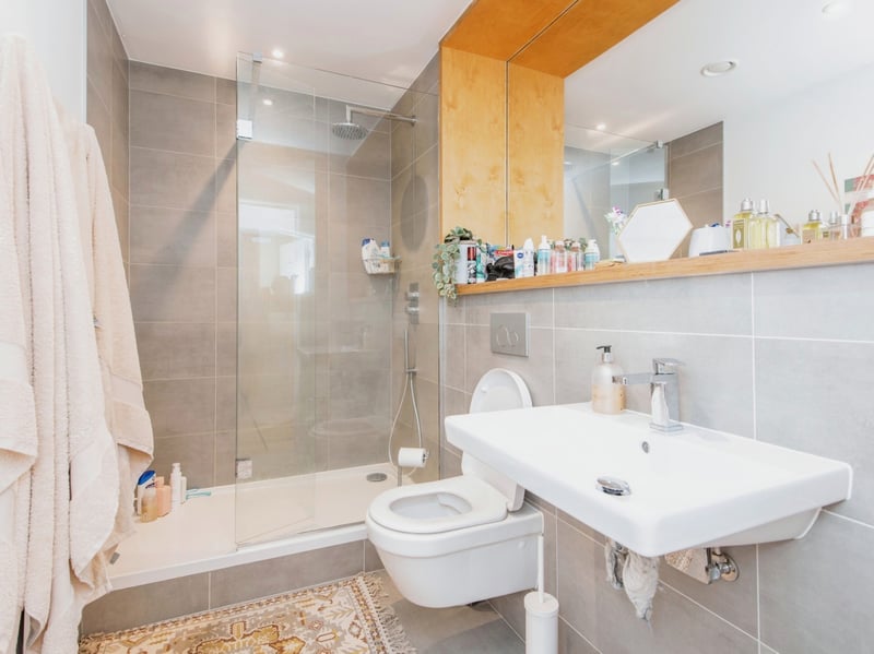 The three-piece shower room is found in the centre of the apartment.