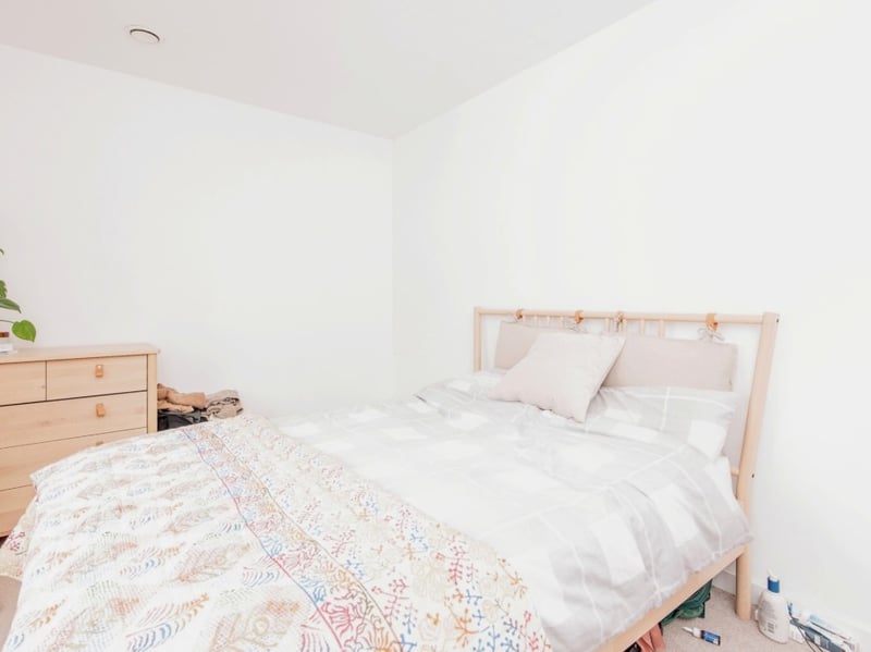 It is a big bedroom, with plenty of space for a double bed and additional storage furniture.