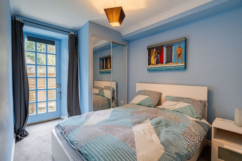 On the ground floor there is a good sized double bedroom with built-in mirrored wardrobes and doors that open onto the Juliette balcony which overlooks the gardens.