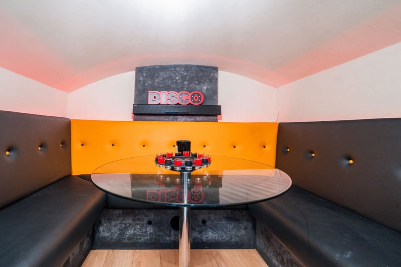 The soundproofed games room with built in seating and table is perfect for gamers to play for hours without disturbing anyone else in this Stockbridge apartment.