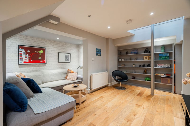 The living room, which is positioned downstairs, is spacious, and through a hidden door, links to a soundproofed games room. Originally a cellar, this space is now perfect for those who want to party into the wee hours without disturbing the neighbours.