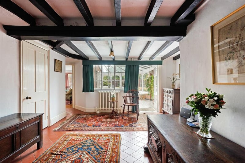 The house retains many period features, including wooden ceiling beams 