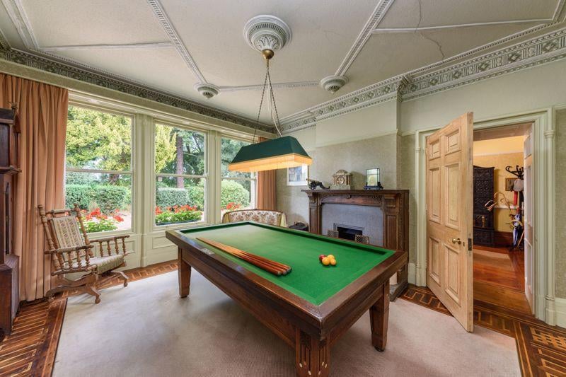 The property's games room houses a classically designed pool table.
