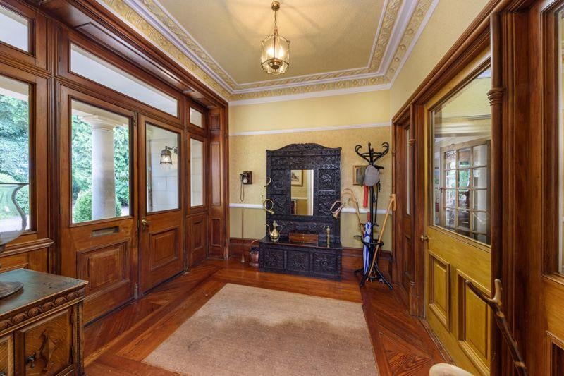Upon entering the property through a set of stone pillars, you are greeted by a well-presented entrance hall.