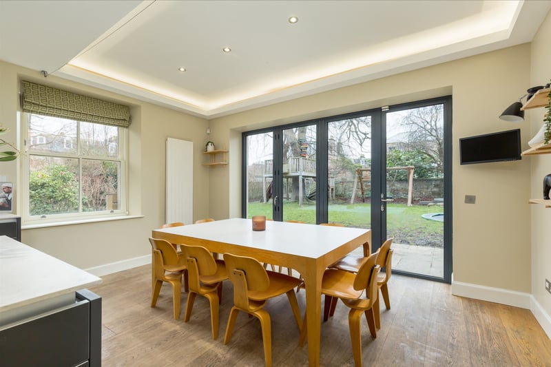 Forming the heart of the home is a bright rear open-plan kitchen and dining space.
