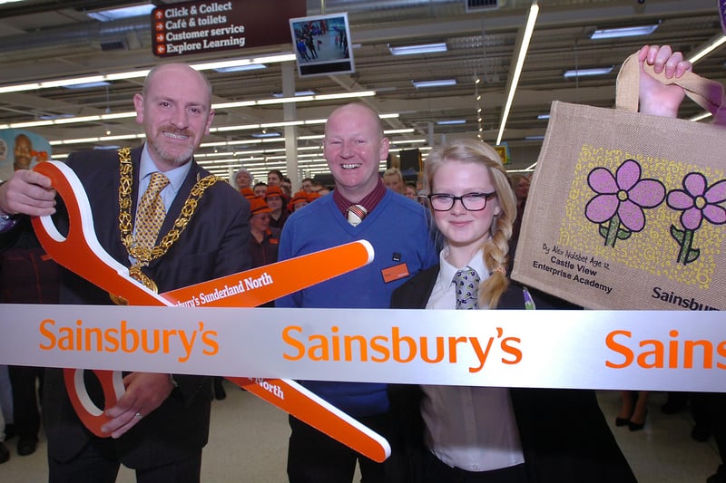 Mayor of Sunderland, Iain Kay, Store manager Chris Stevens and Castle View academy pupil, Alex Naisbet officially opening the new Sainsbury's store.