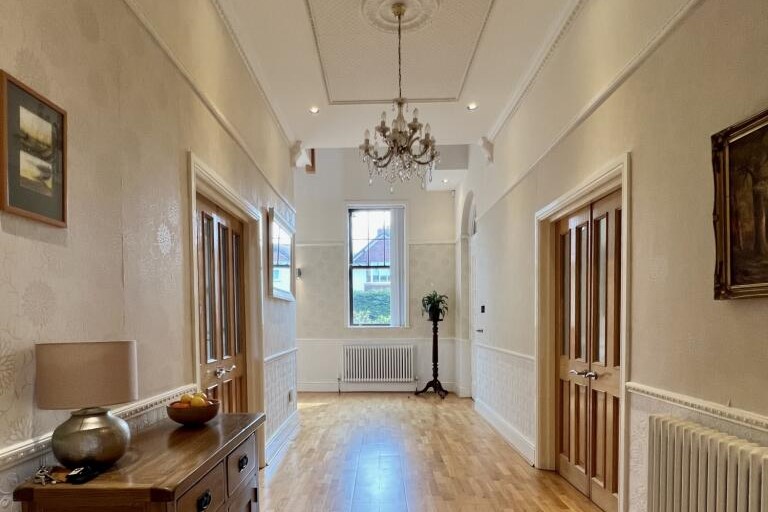 On entering through a wide solid wood door you are greeted by a beautiful wide hall leading to a double height galleried landing that has the wow factor.