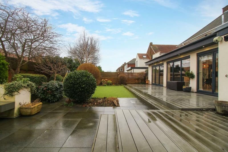 The rear garden is generously sized with separate decking, lawn and seating areas.