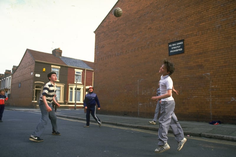 Children play street football - a common sight in the 80s