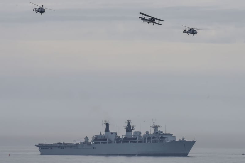 Watch this Royal Navy Flypast featuring the Black Cats helicopter display team and a World War Two vintage Fairy Swordfish in 2016.
They flew over HMS Bulwark.