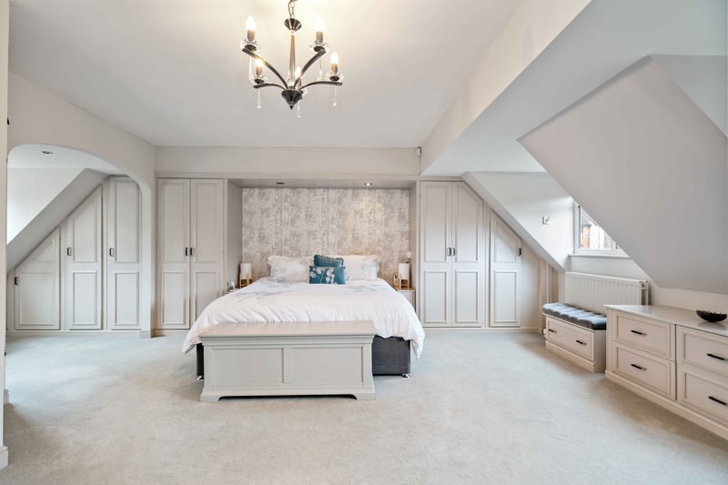 Proceeding up the oak staircase, the principal bedroom has bespoke wardrobes and a luxurious en-suite bathroom, with three additional, spacious bedrooms with fitted wardrobes and a family bathroom