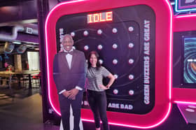 Reporter Kirsty Hamilton posing with (a carboard cut out of) genius Shaun Wallace, also known as the Dark Destroyer from The Chase at Gameshow All-Stars bar in Sheffield.