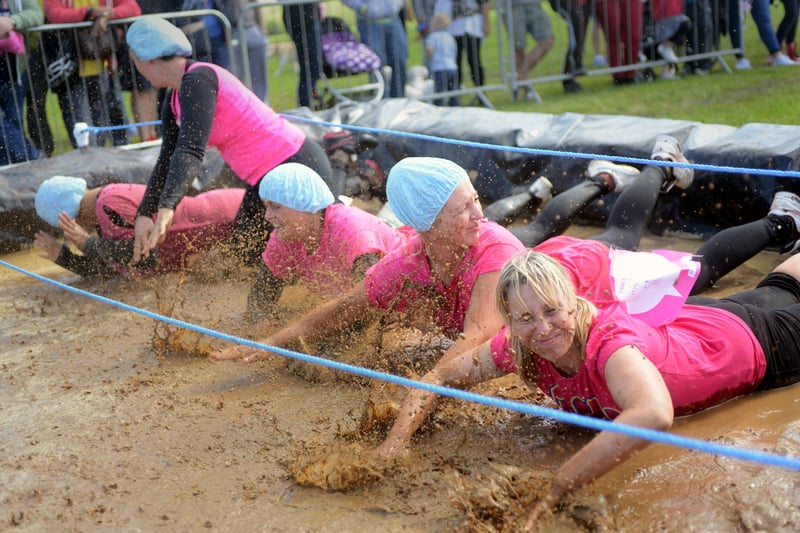 A Red House team gets into the spirit of the first ever Cancer Research UK Race for Life Pretty Muddy event at Herrington Country Park.