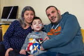 William with his mum Mihaela and dad Simon. William Howard, nine, was told by doctors his initial symptom, a twitch in his right leg, could be down to stress from playing Minecraft but in fact he has a rare and deadly disease.