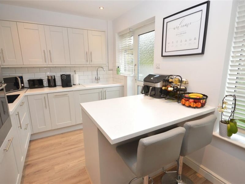 To the rear sits a modern dining kitchen.