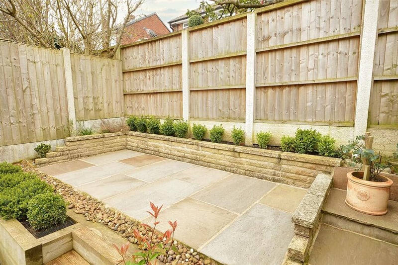 It offers a great degree of privacy and features a patio and planted borders.