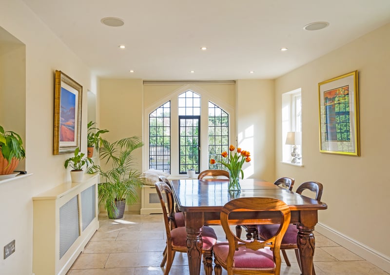 The breakfast area includes leaded windows and overlooks the front elevation.