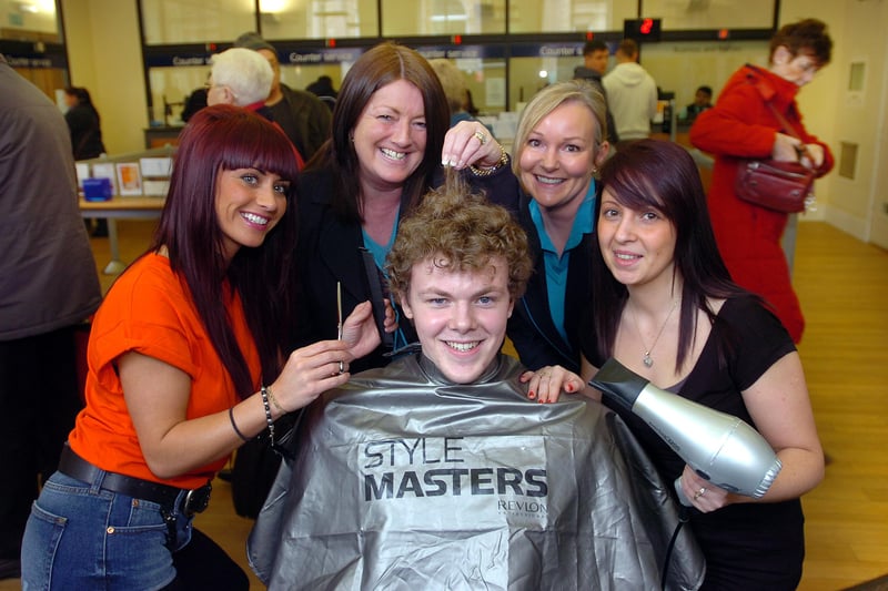 Lewis Wiseman from the Fawcett Street branch of Barclays Bank, visited the barbers chair for a quick trim in aid of Comic Relief in 2013. 
Ashley Demby, Linda Fishburn, Susan Kalmins, and Donna Musleh joined him.