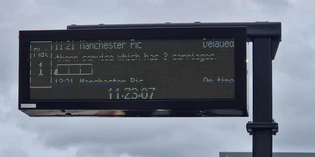 Station information showing a train from Sheffield to Manchester Piccadilly is delayed. The Government has committed to improving rail infrastructure through Network North.