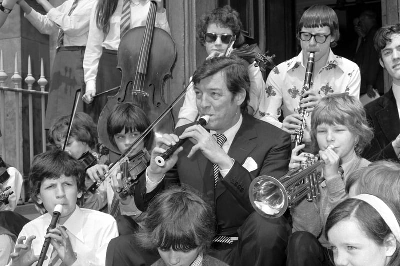 Alexander Gibson, principal conductor with the Scottish National Orchestra, playing the recorder with some pupils from St Mary's Music School orchestra at the launch of a public appeal for £70,000 for the school's boarding house in June 1976.