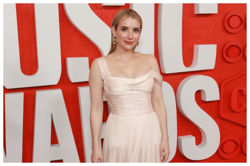 Actress Emma Roberts looked super chic in a Dolce & Gabbana gown that she accessorised with gold bow and arrow heart earrings by Irene Neuwirth