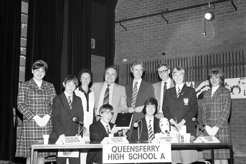The Queensferry High School quiz team took part in the Round the Regions school quiz in December 1979.  Here, Douglas Cameron, Gordon Dalyell, Catherine Beer and Aileen Lynn are pictured with with quizmaster Bamber Gascoigne (centre).