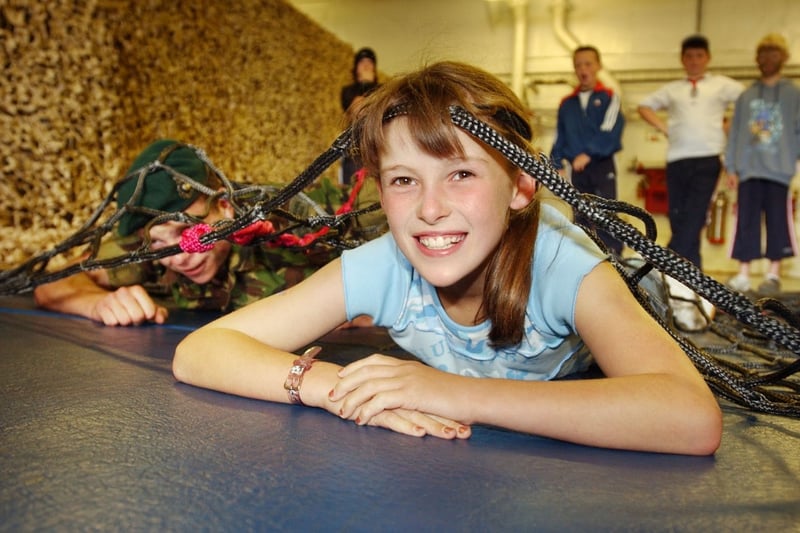 Charlotte Rathbone, 9, raced Marine Paddy McDowell through the scramble net in this photo from 2004.
