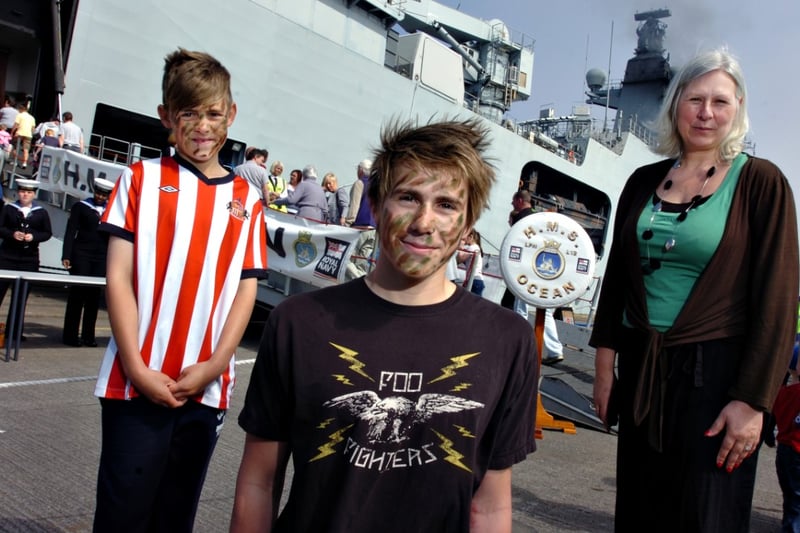 Joe Middleton and his younger brother Tom tried out the camouflage paints when they visited the ship in 2012 with their mum Alison Brumwell.