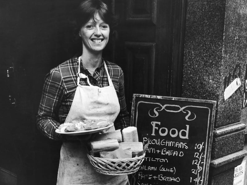 Snack bar manageress Sylvia Barber outside the King's Head pub in Upper Street on June 23 1980. The food menu is priced in pre-decimal currency, which had not officially been used in Britain since 1971.