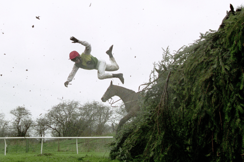 Tom Doyle of Ireland parts company with his mount Esprit de Cotte at the 11th fence during the 2001 Martell Grand National held at Aintree.