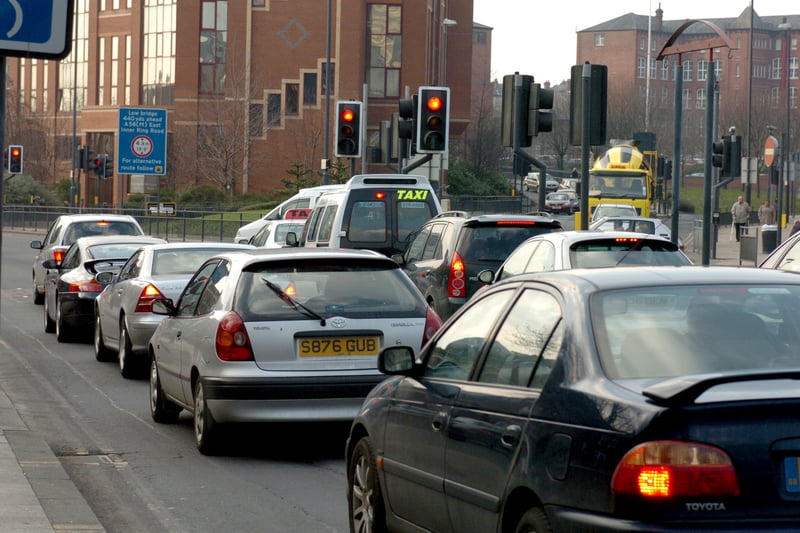 Plans were unveiled to synchronize traffic lights around the cvity centre in February 2005. Pictured are cars queuing at traffic lights on The Headrow.