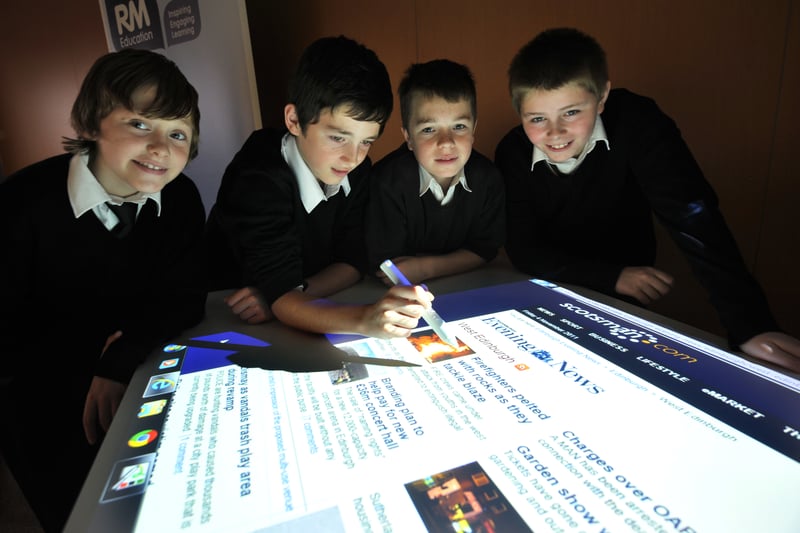 Workshops were held at Tynecastle High in November, 2011, to showcase new technologies that can be used as teaching aids in the classroom. Pictured (left to right) is Brandon Anderson (12), Kieran McCready (11), Matthew McLauchlin (12) and David Lamb (12) taking a look at the Edinburgh Evening News website on the Ver Table.