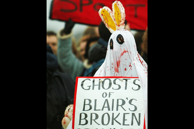 An animal welfare protester gets their message across during the annual Waterloo Cup event in February 2004. The event saw greyhounds chase after hares and ended in 2005 following the introduction of The Hunting Act.