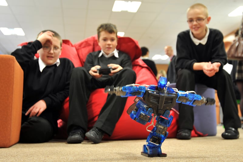 Tynecastle High School S2 pupils pictured in November, 2011, playing with an ED-E robot as part of workshops to showcase new technologies that can be used as teaching aids in the classroom.
