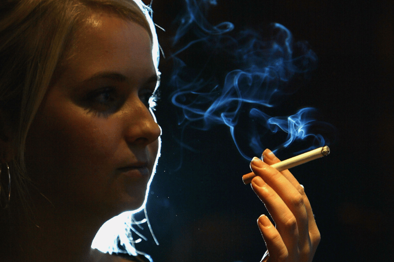 A woman smokes a cigarette in a cafe in Liverpool in 2004 
as Liverpool City Council voted on the prospect of banning smoking in all public places.