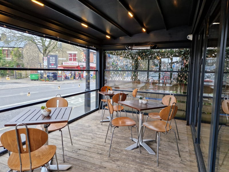 Additional seating is on an enclosed terrace at the front of the restaurant, allowing diners to watch the world go by.