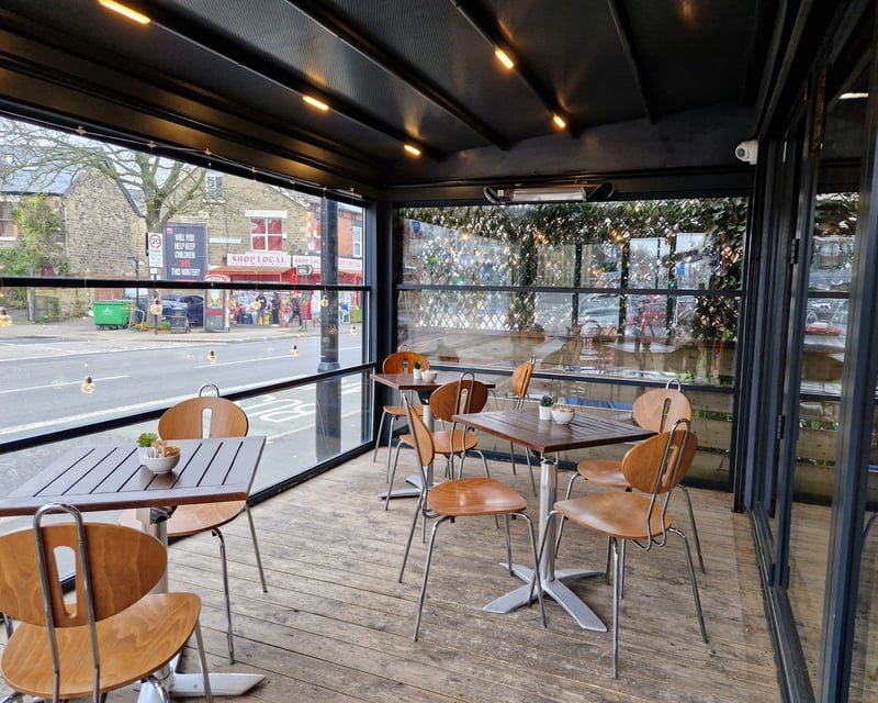 Additional seating is on an enclosed terrace at the front of the restaurant, allowing diners to watch the world go by.