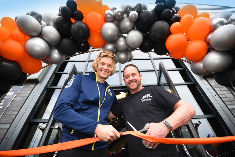 Lyndon Poskitt (left) and General Manager Richard White cutting the ceremonial ribbon at the opening of Iron City Motorcycles in South Tyneside.