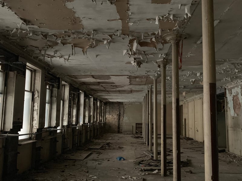 Reports indicate that prolonged vacancy and lack of comprehensive restoration have led to weakened structural elements, rotten windows, and ongoing deterioration of the façades. It has been on the National Buildings at Risk Register since 1990.