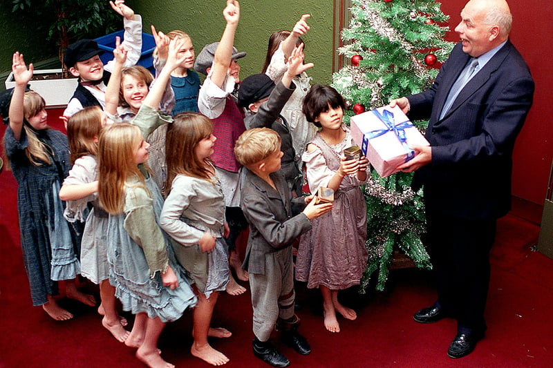 Pupils receive a first night good luck gift from Grand Theatre general manager Warren Smith in December 1999. They were extras in the Northern Ballet Theatre's production  of A Christmas Carol.