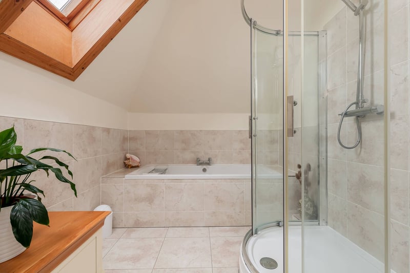 The main bathroom with white 3-piece suite comprising wash hand basin, bath and separate shower cubicle, situated on the second floor.