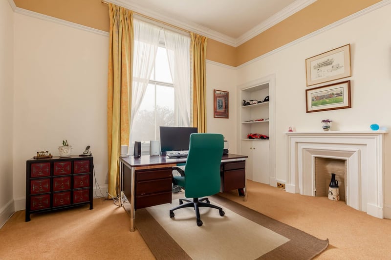 The property's fourth bedroom, located on the ground floor, is currently used as a good-sized office.